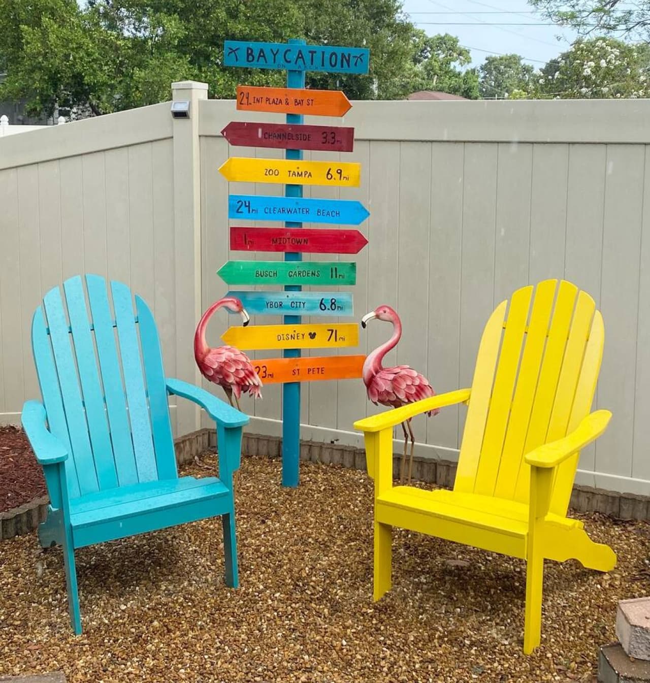 Two chairs, a splash of color, and pure backyard vibes—your official Tampa chill zone. The perfect spot for a photo (or three) to post on social!