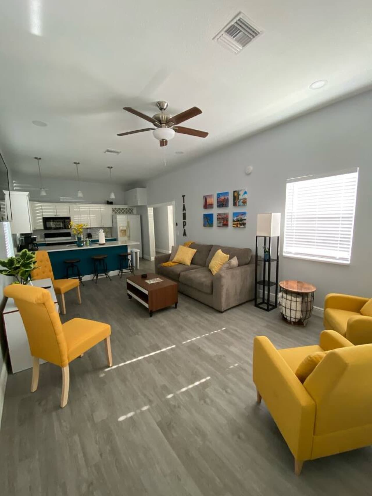 Let the vibrant accents and comfy sofa set the tone for a laid-back stay.