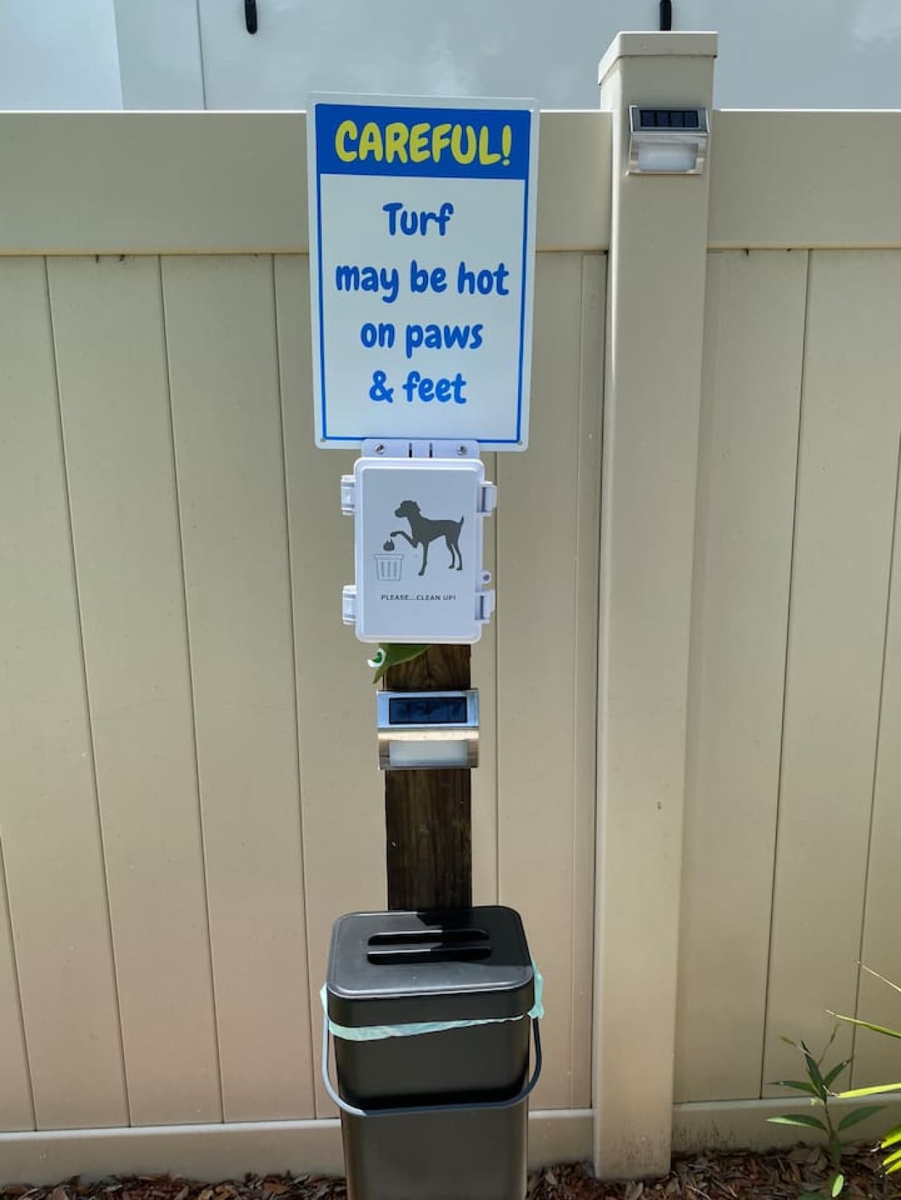 A dog-friendly yard complete with a clean-up station for your furry friends.