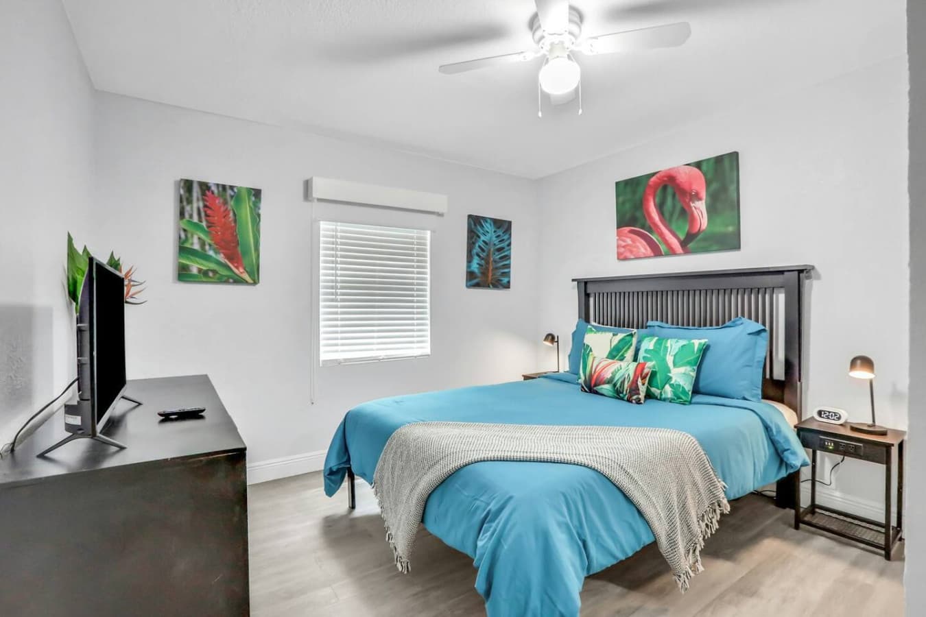 A queen bed with a coastal twist—vibrant, airy, and ready for relaxation.