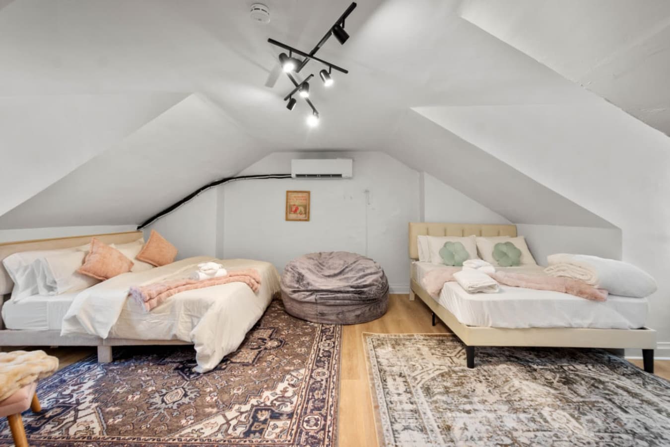 Attic charm meets modern functionality—two beds, one perfect space.