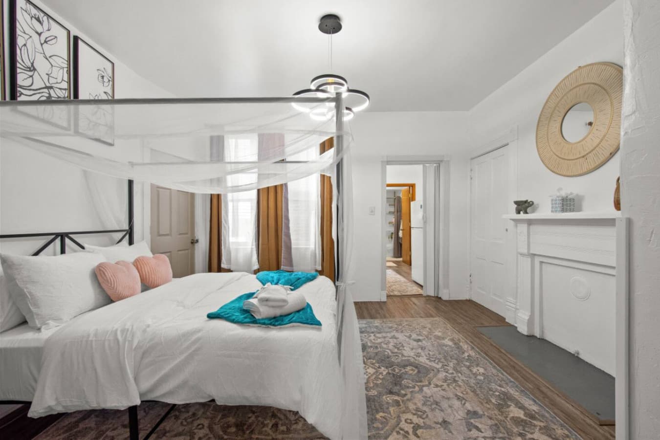 A queen-sized retreat wrapped in light and style.