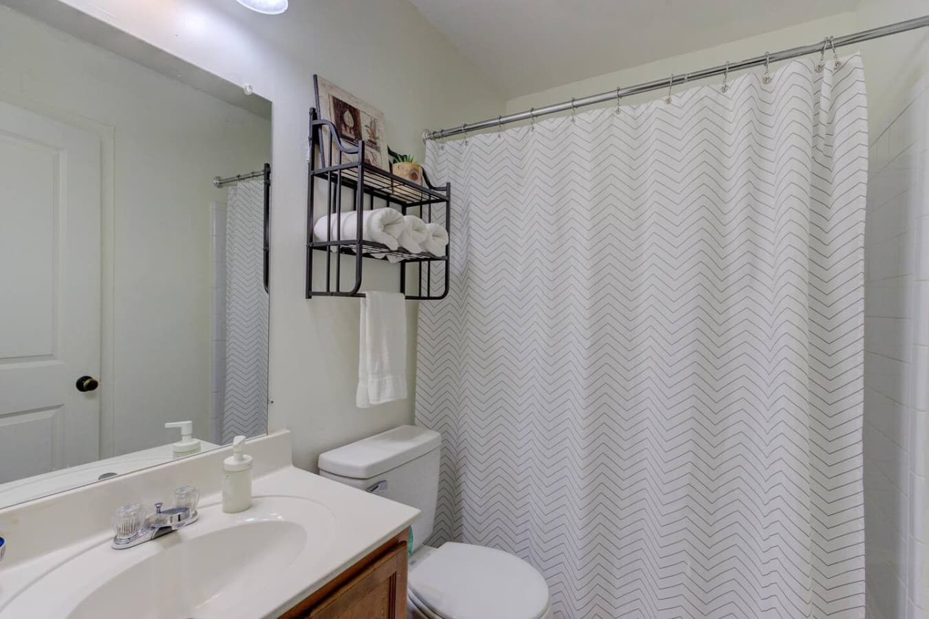 Soak your cares away in the bright bathroom—complete with all the essentials for your stay.