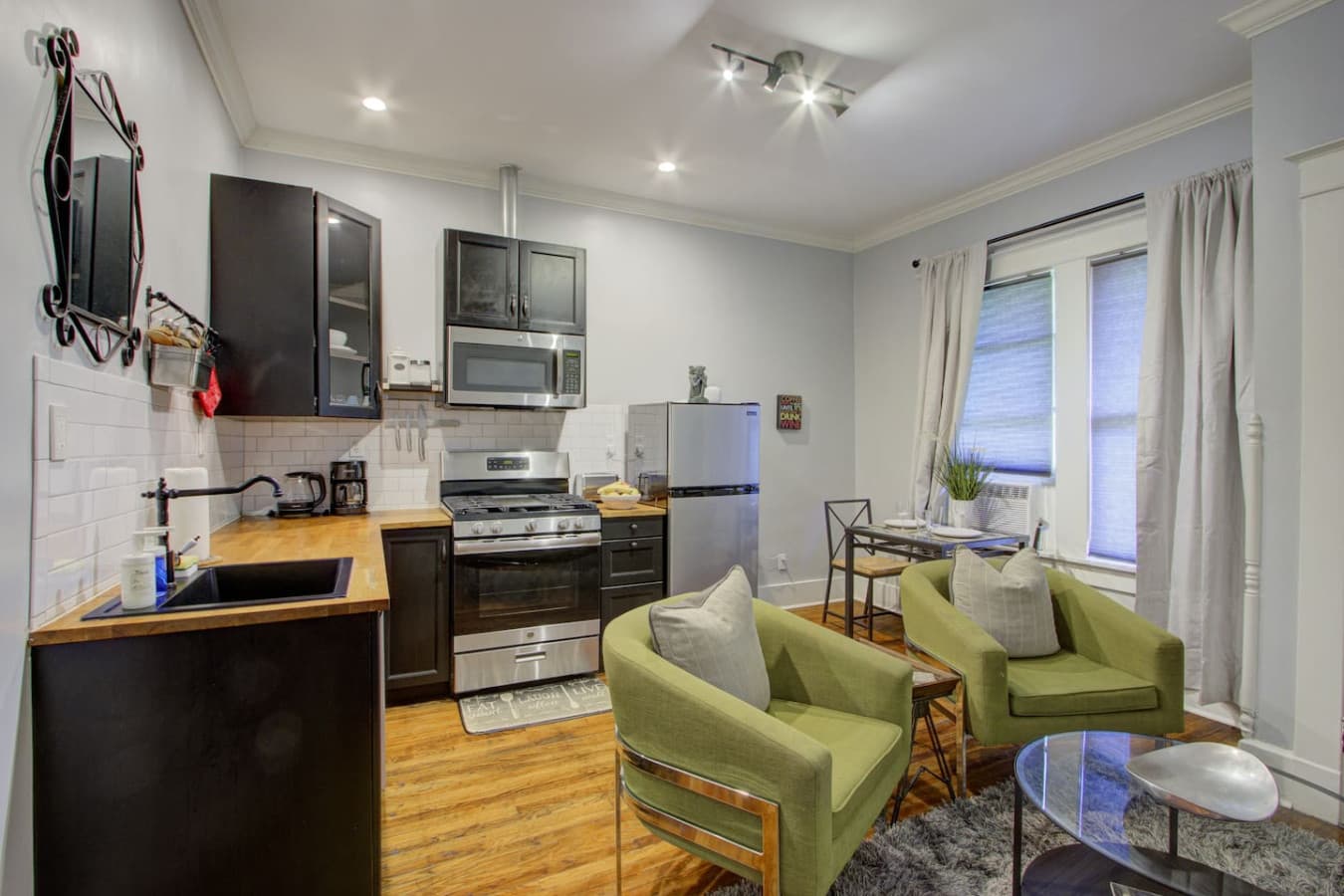 Open view of the kitchen, dining, and living areas, all connected in one inviting space.