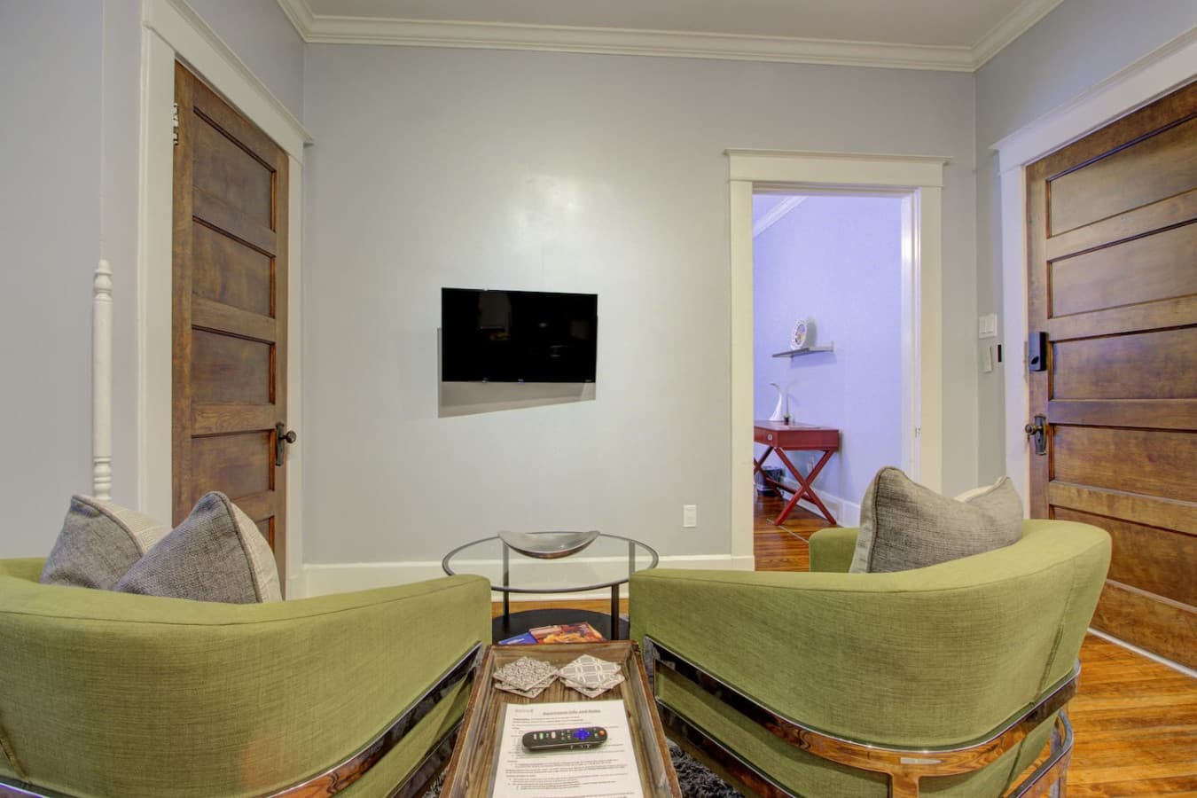 Inviting setup, plush sofa and TV for movie nights or downtime.