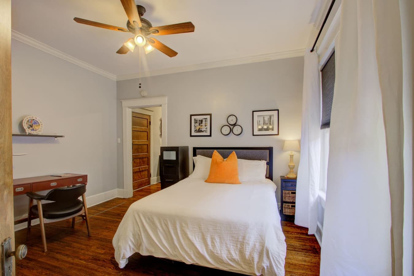 Peaceful retreat with a comfortable bed, thoughtful décor, and space to work if needed.