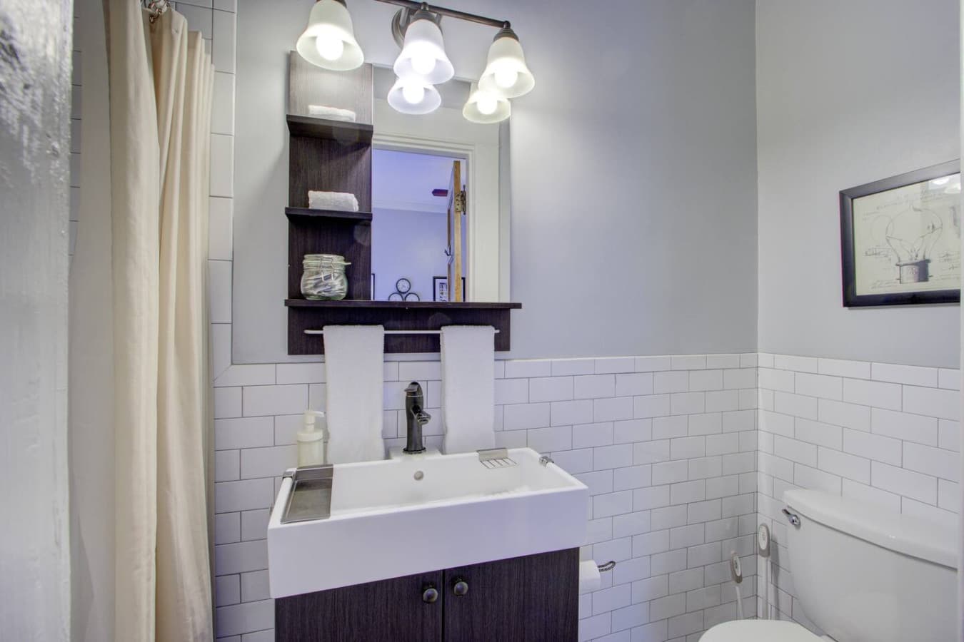 Fresh, well-lit bathroom designed for comfort and convenience.