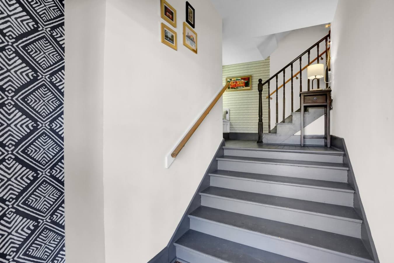 A charming, historic staircase that connects you to this inviting space. This is a shared staircase but you have your private entrance to your unit