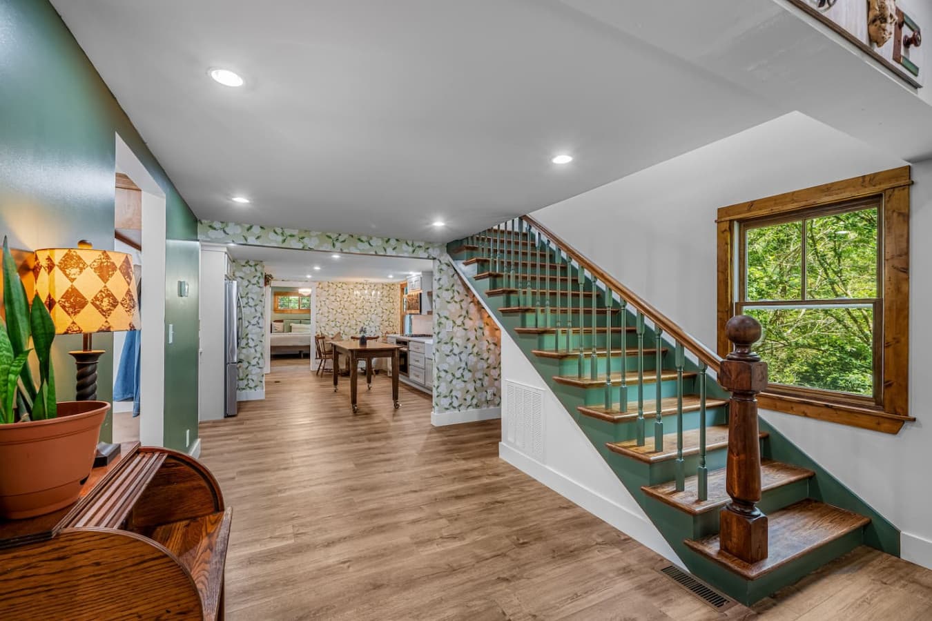 Charming stairs lead you to cozy rooms, while the secretary desk offers a quiet nook for writing or planning your day.