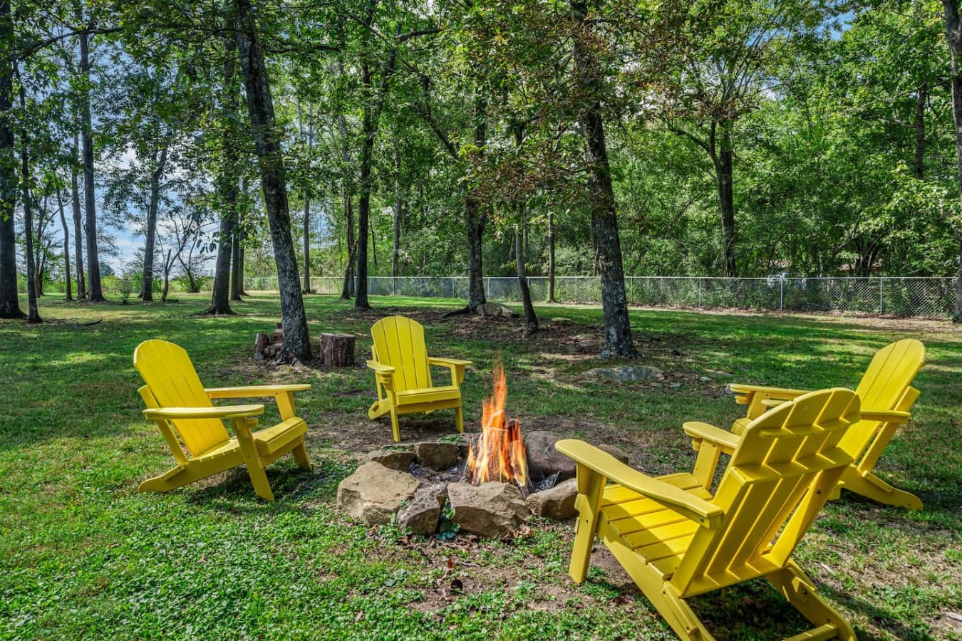 Gather around the fire pit in cozy Adirondack chairs for a peaceful evening under the stars.