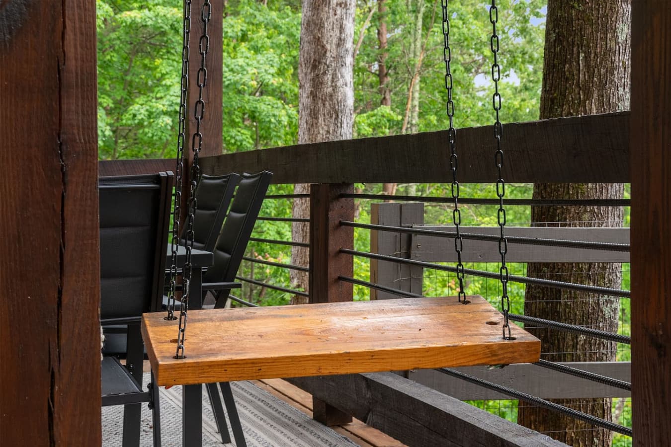 Embrace the tranquility of the mountains with a peaceful swing on the lower deck—where every breeze feels like a hug.