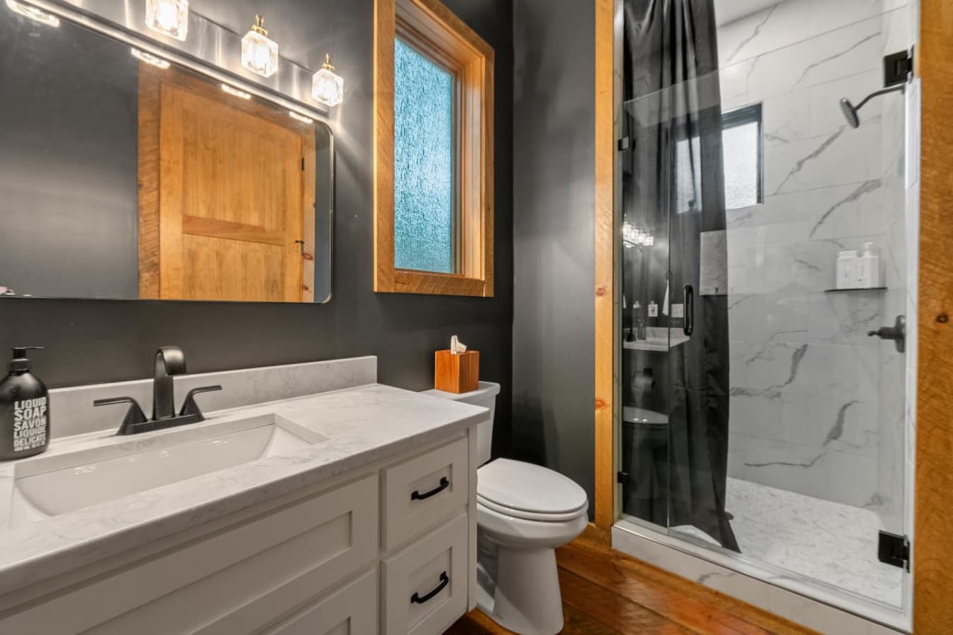The sleek, modern design of this walk-in shower transforms your daily routine into a spa-like escape.