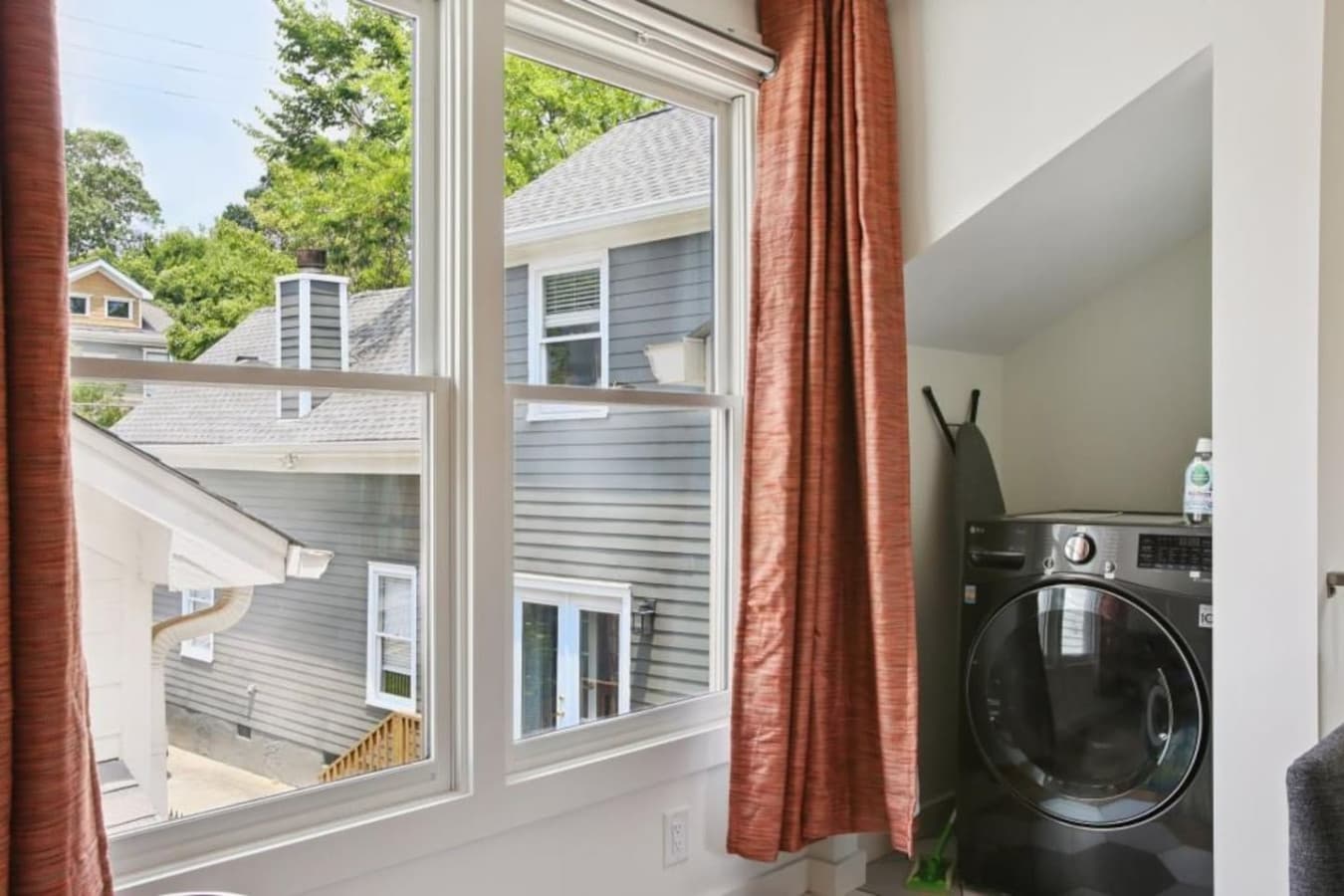 Streamlined and space-saving, this laundry nook is equipped with a washer/dryer combo for your convenience.