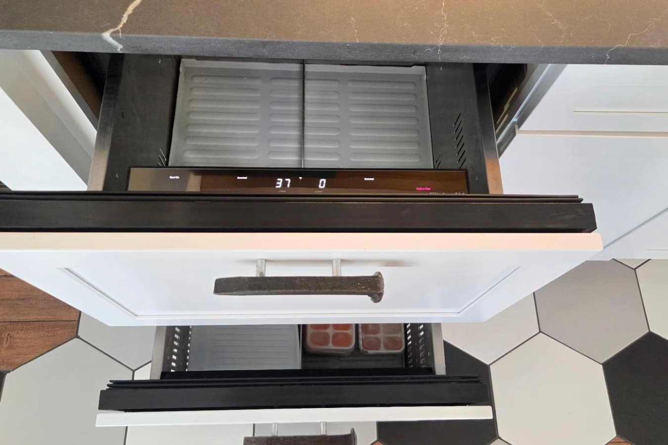 Built-in refrigerator and freezer drawers for convenient storage.