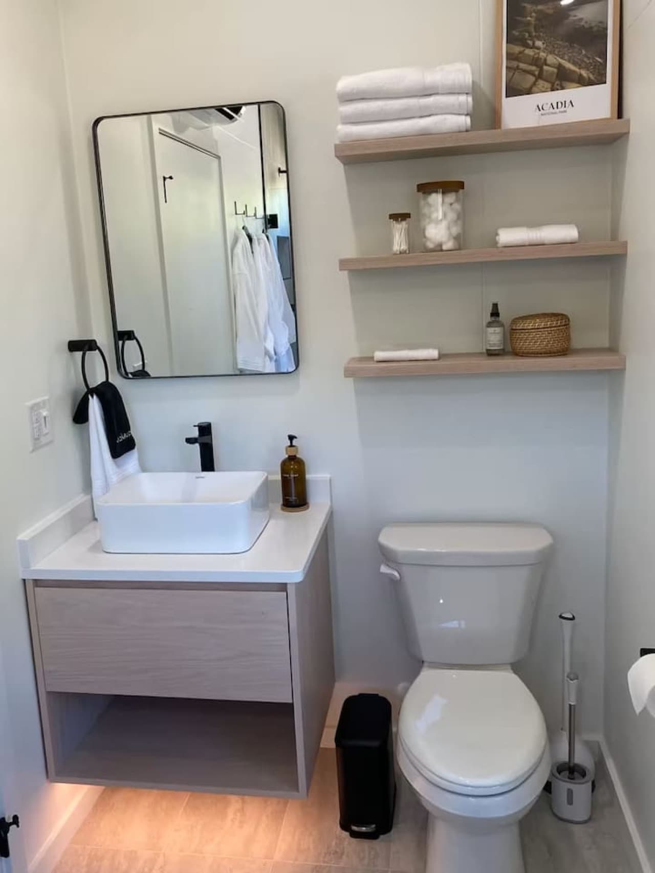 Freshen up in the full bathroom stocked with shampoo, conditioner, shower gel, and soft towels for a spa-like coastal touch.