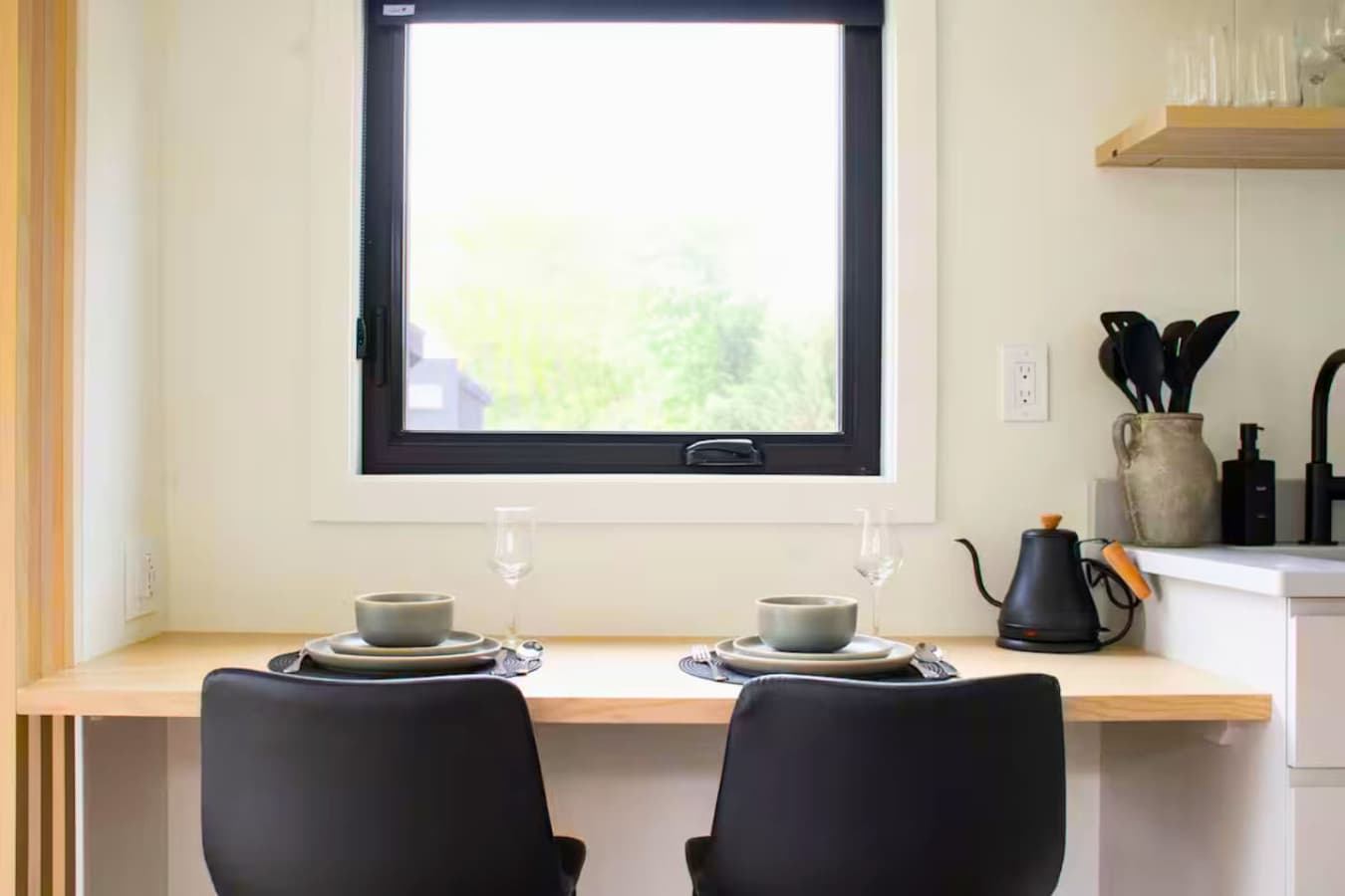 A charming dining nook for two — perfect for morning coffee, a seafood dinner, or a quiet evening in.