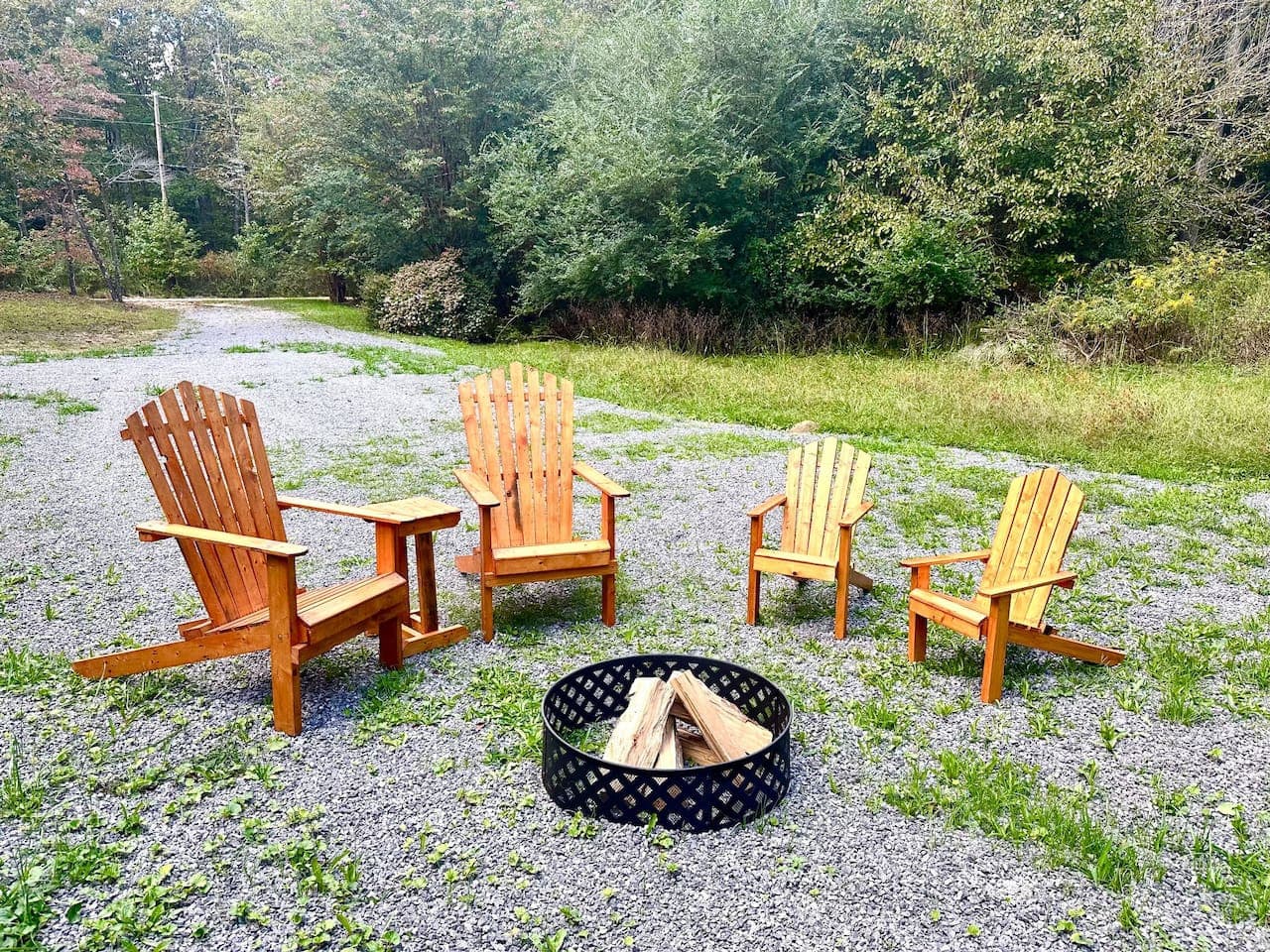Firelight flickers, fresh air fills your lungs, and Adirondack chairs await—your perfect retreat. (Firewood not provided; please bring your own.)