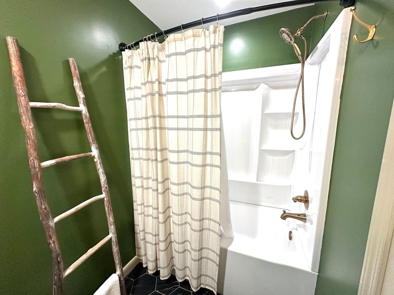 Enjoy a refreshing shower or a long soak in this well-appointed bathroom.
