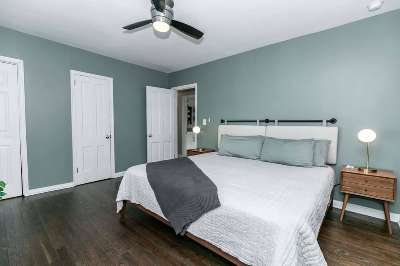 Your private sanctuary awaits—a spacious primary bedroom featuring serene, designer-selected colors.