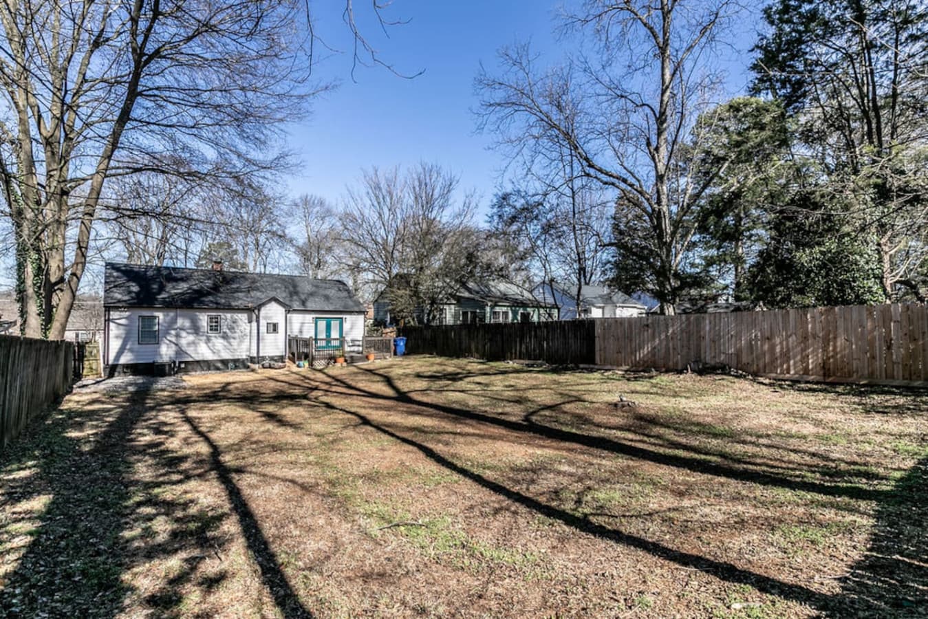 Backyard oasis with room for pets, games, or lounging.