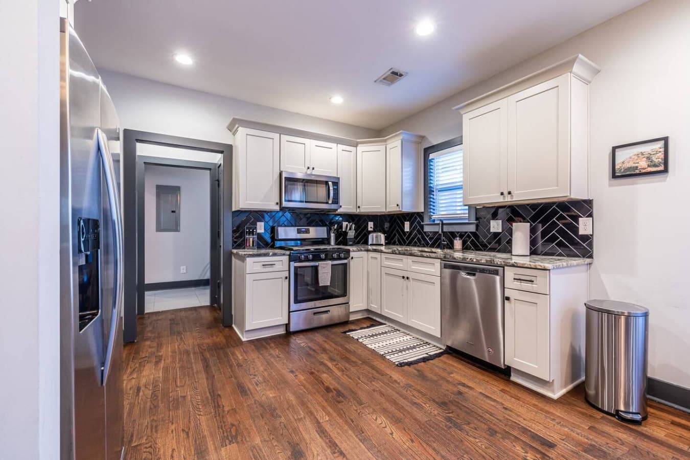 Fully stocked kitchen with a gas stove, perfect for cooking meals, brewing morning coffee, or trying out a new recipe during your stay.