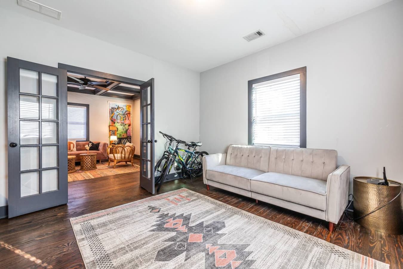 This versatile front room flows seamlessly into the living area, offering extra space for work or relaxation. Two bicycles are provided for guest use, making it easy to explore the neighborhood.
