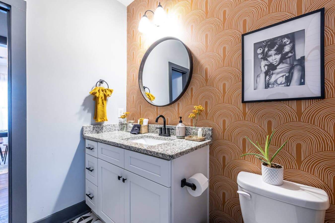 A warm, boho-inspired bathroom with earthy textures and stylish accents, perfect for a relaxing start or end to the day.