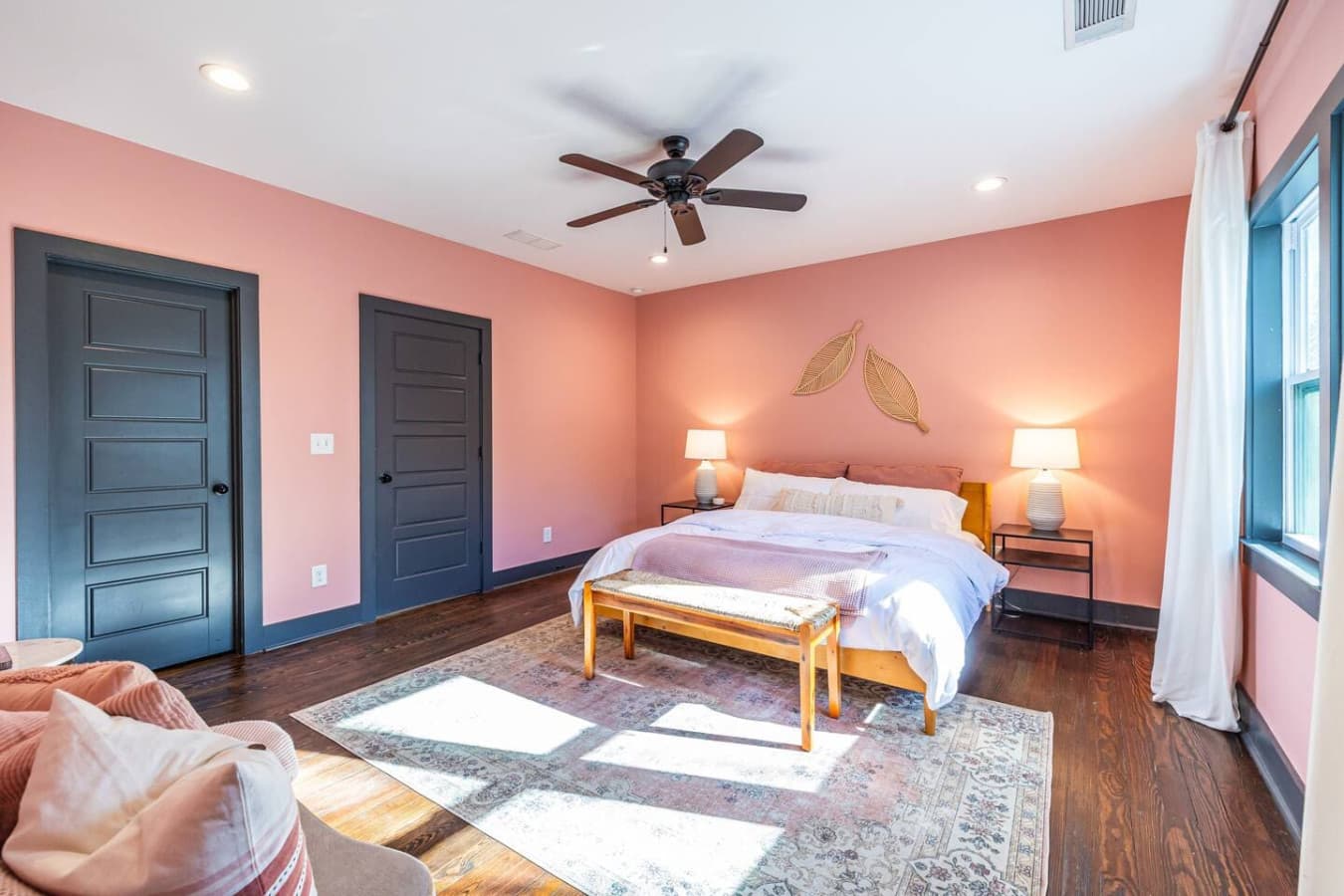 Sink into comfort in this primary bedroom, featuring a king bed and a soothing, restful ambiance.