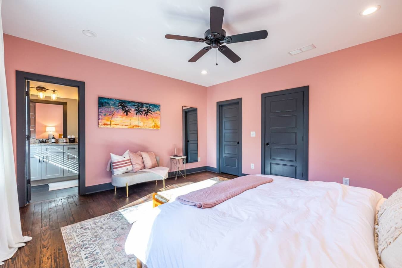 Relax in this spacious primary suite, complete with an ensuite bathroom and a soothing atmosphere.