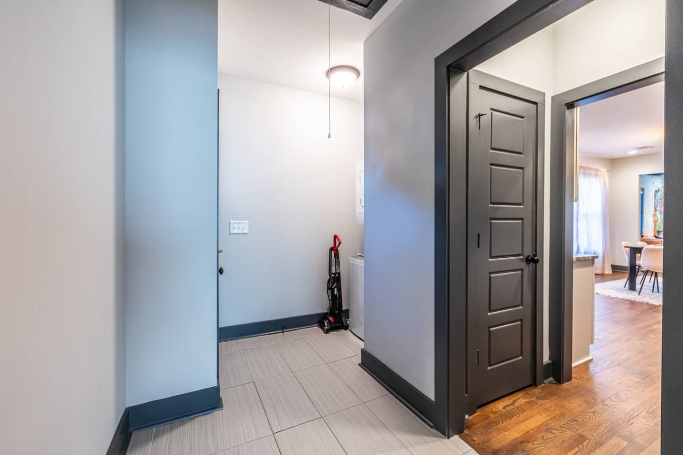 Just steps from the kitchen, this laundry area offers convenience and practicality for daily living.