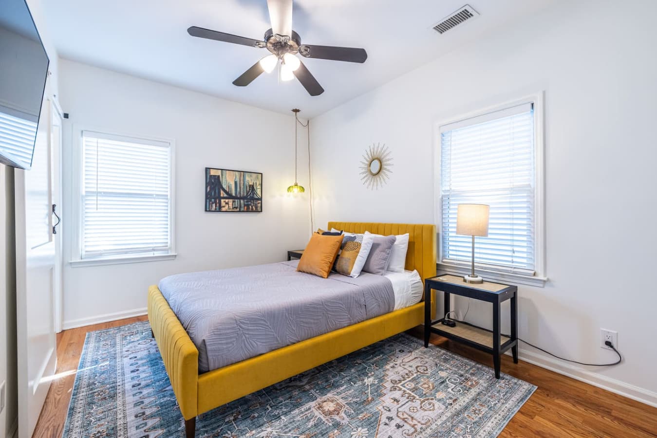Bright and serene primary bedroom with a comfortable queen bed.