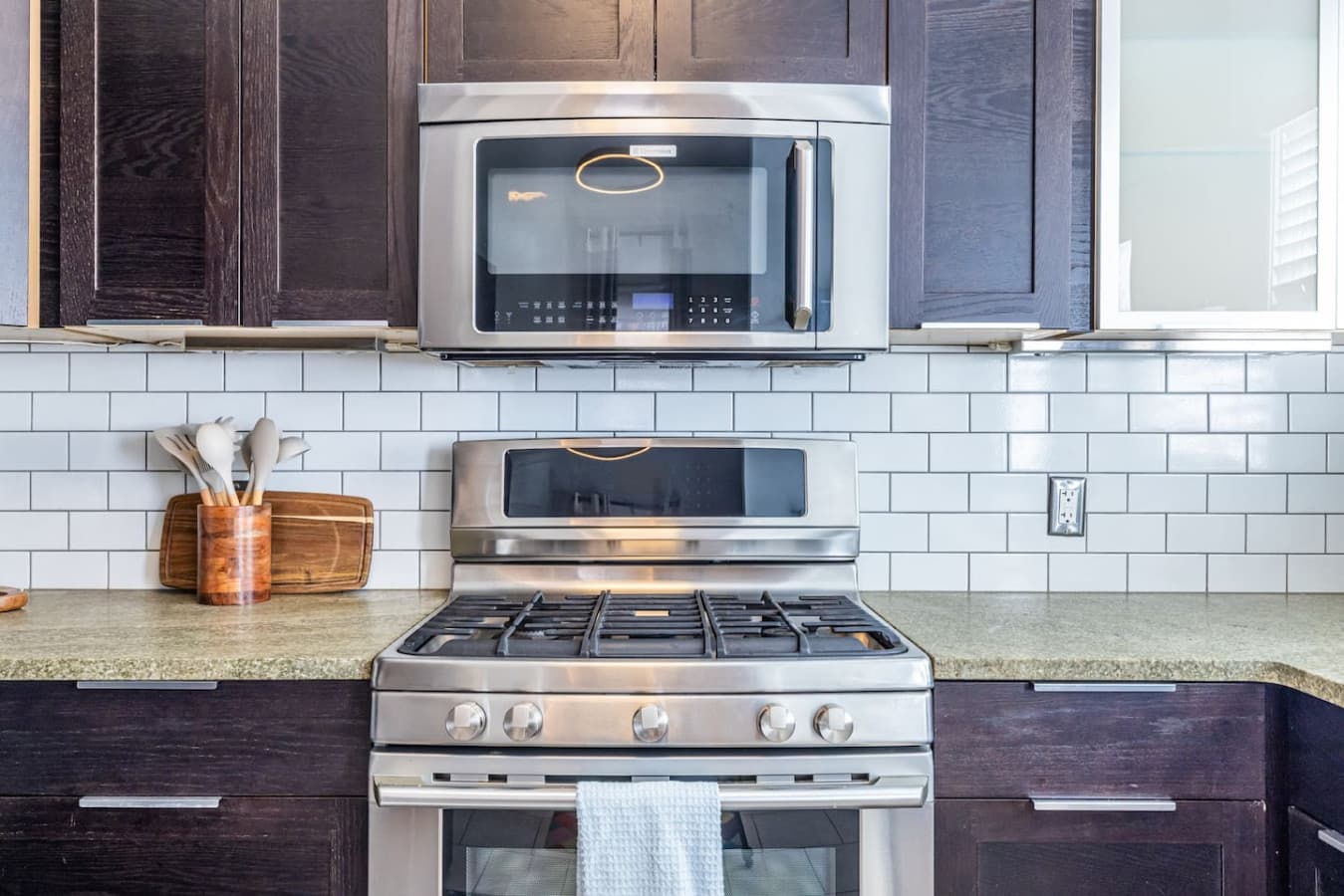 Cook with ease on the high-end gas stove in this bright, functional kitchen.