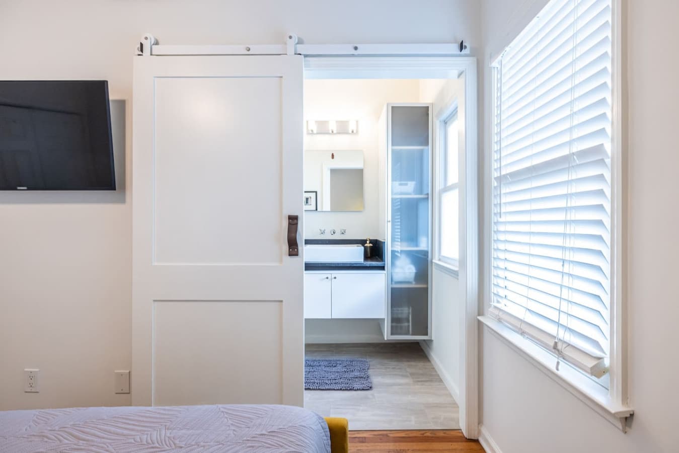 Enjoy a seamless transition from restful space to your private bathroom.