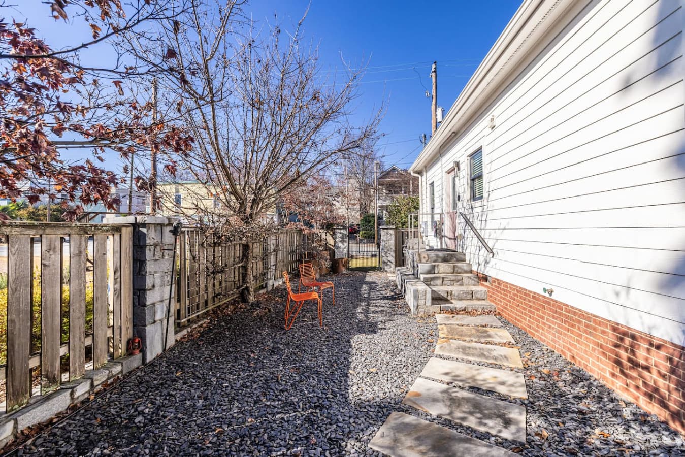 Step out from the kitchen into a lush, well-kept side yard that’s perfect for relaxing.