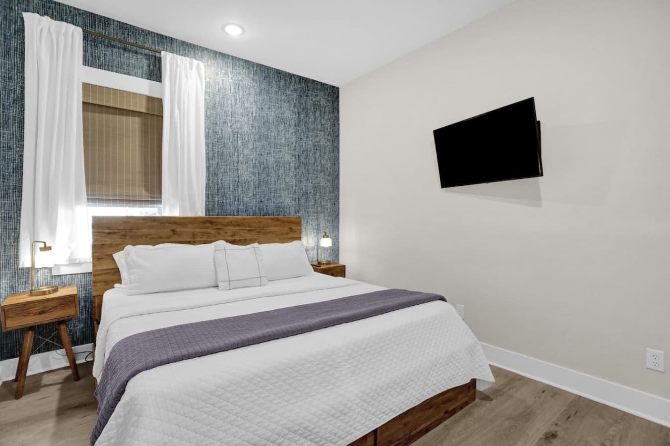 Watch your favorite shows from the comfort of your king bed