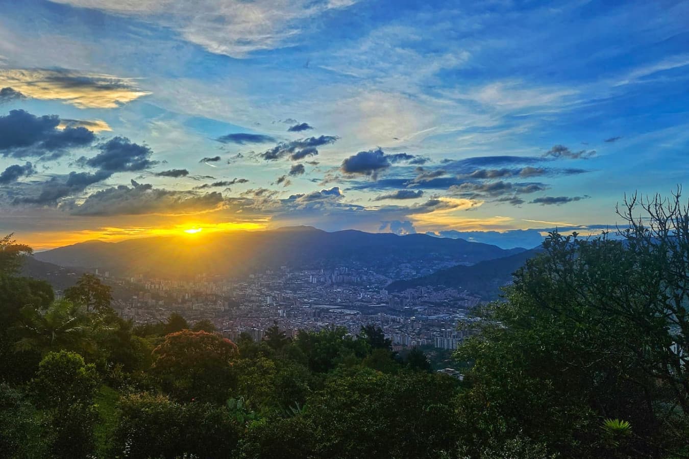Soak in the magic of sunset as the hills fade into a sea of golden and amber tones.