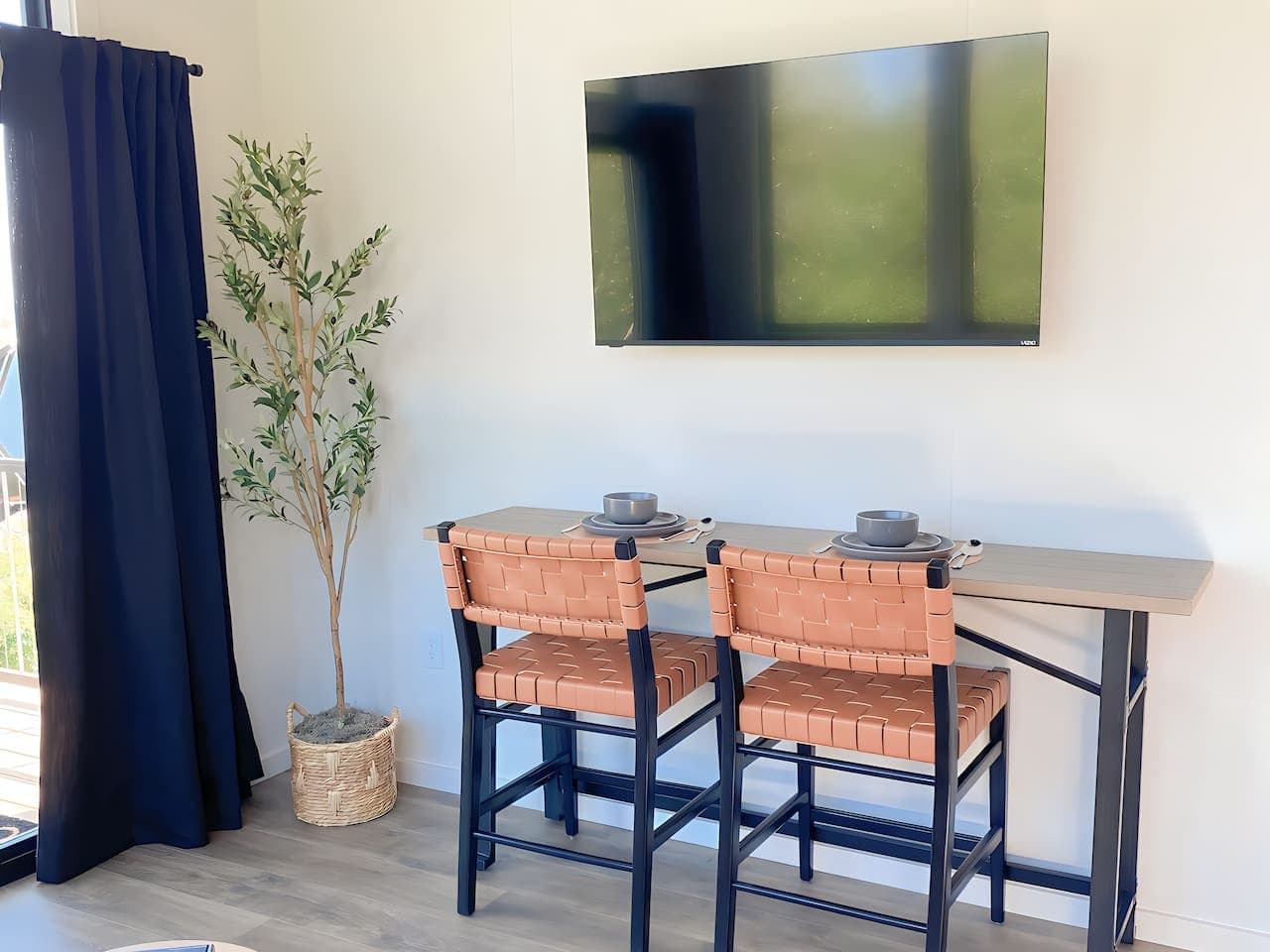 Enjoy a quiet breakfast or set up your laptop at the dining nook. The natural light and calm setting make it ideal for both dining and focused work.