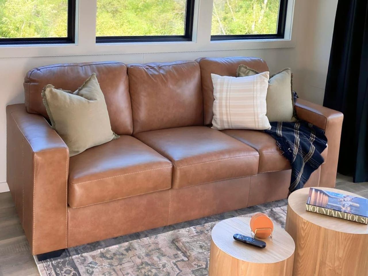 A cozy, light-filled space with a leather sofa and Smart TV — perfect for streaming your favorite show or catching up on remote work with high-speed Wi-Fi.