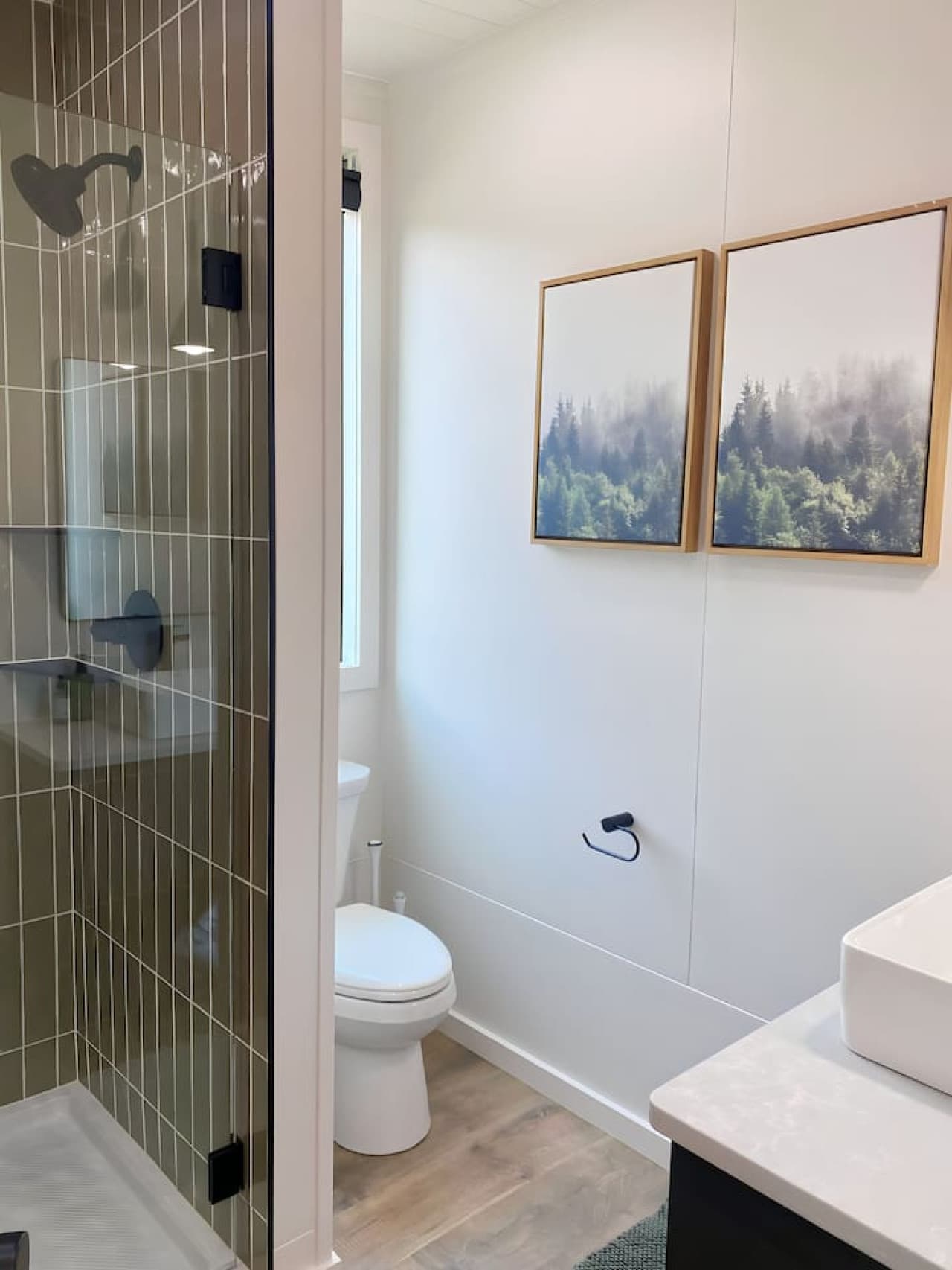 A clean, spa-inspired space with a walk-in shower, modern fixtures, and fresh towels for a refreshing start or end to your day.