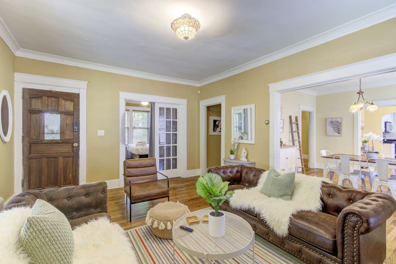 Relax in the cozy living room with comfortable seating and warm natural light.