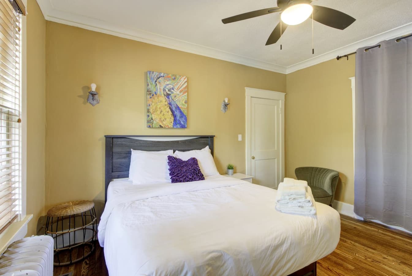 Bright and cozy primary bedroom featuring a queen bed and relaxing ambiance.