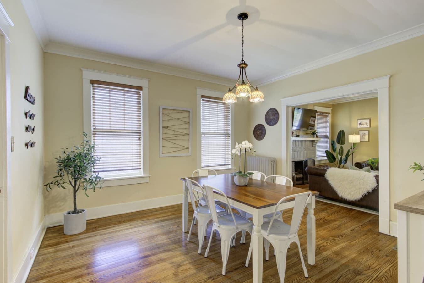 Formal dining room with seating for 6 and nice natural light streaming through the windows.