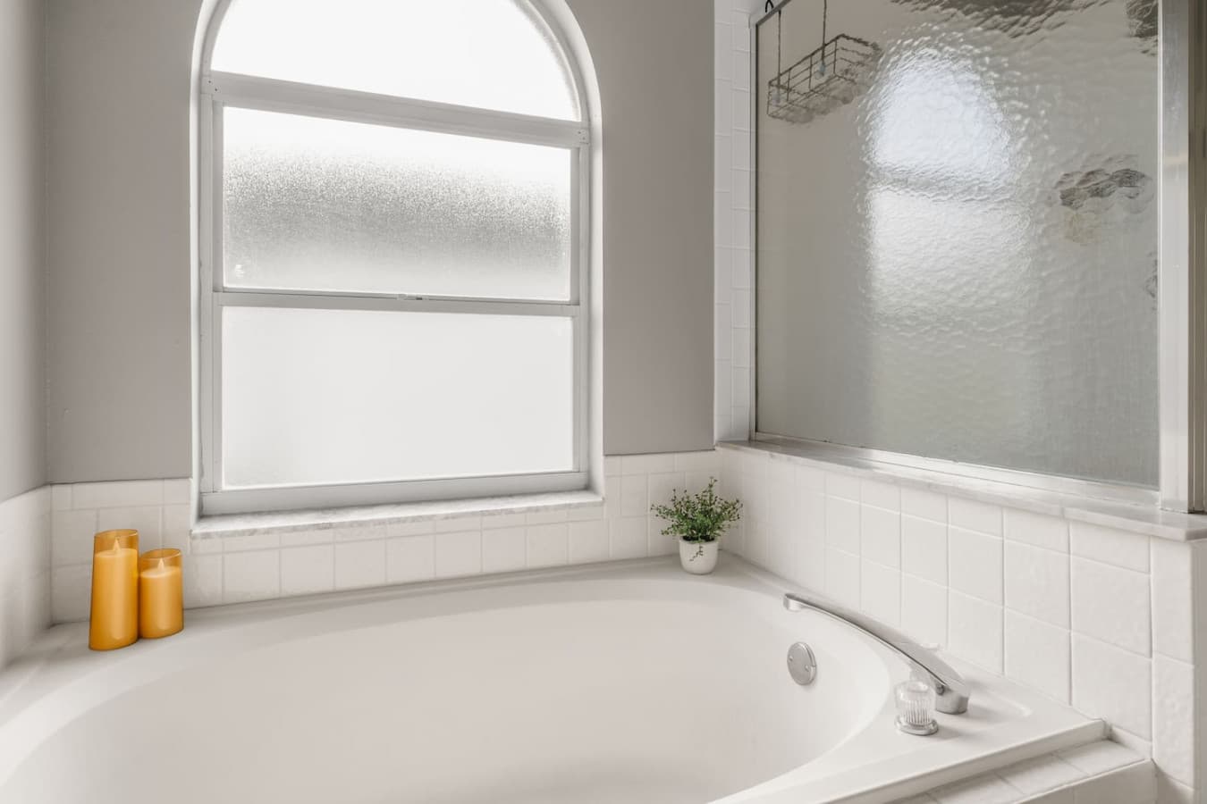 A master bathroom built around relaxation, featuring a beautiful soaking tub.