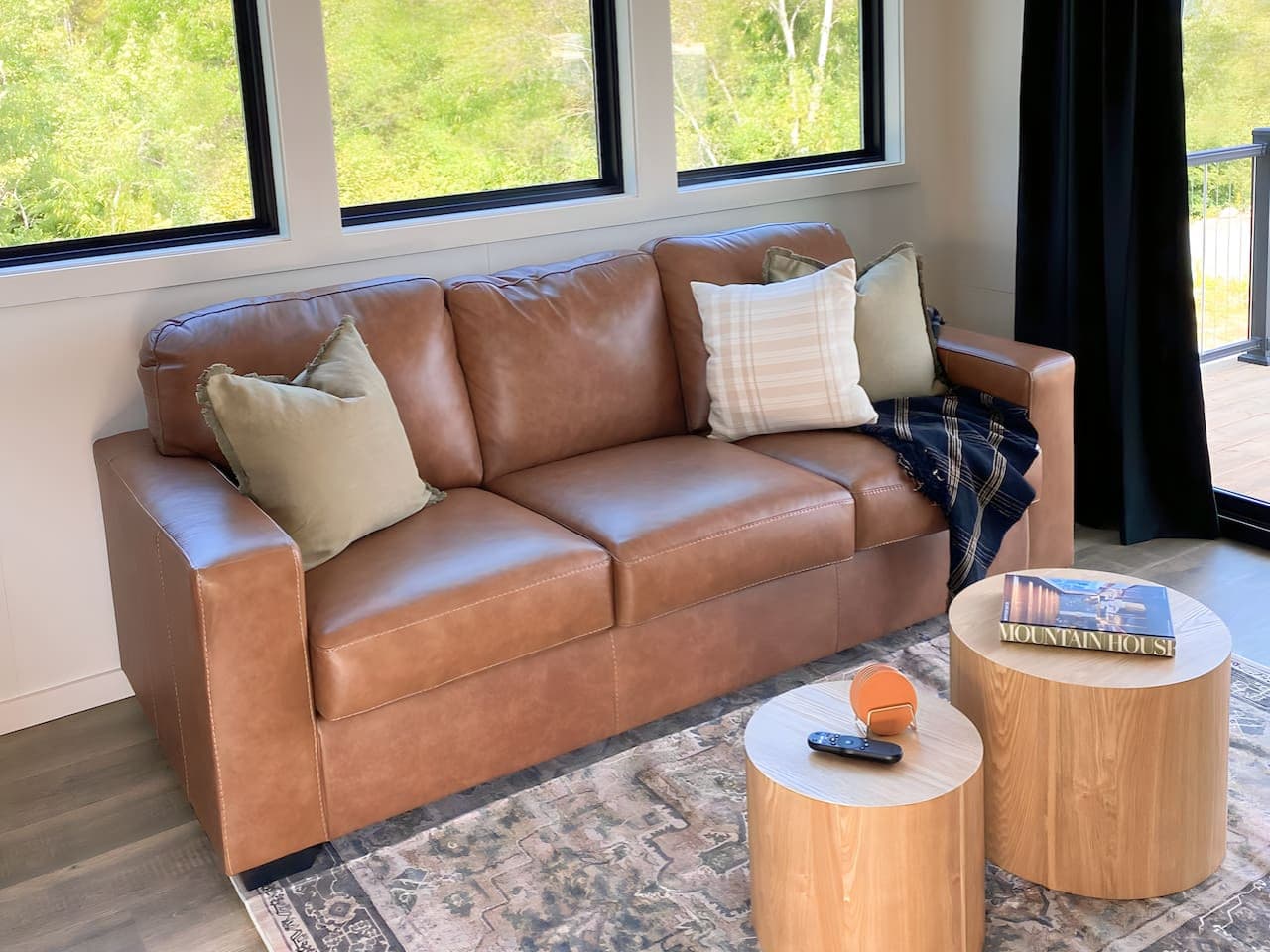 A cozy, light-filled space with a leather sofa and Smart TV — perfect for streaming your favorite show or catching up on remote work with high-speed Wi-Fi.