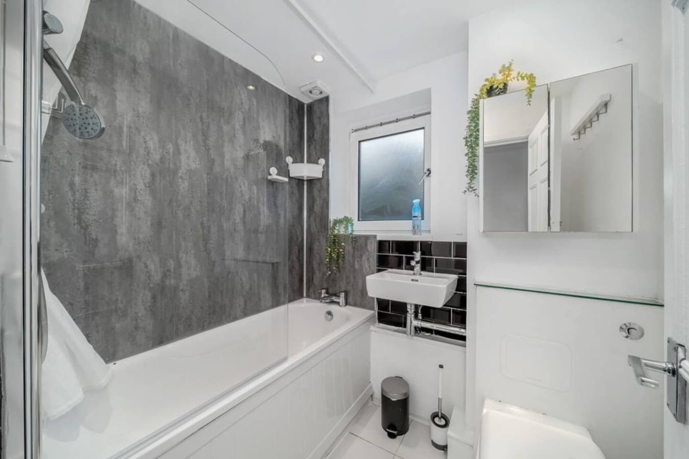 A clean and modern bathroom with all the essentials. Unwind with a bath or refresh in the shower—your choice!