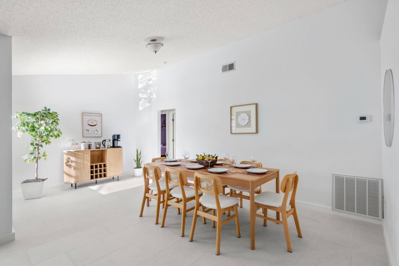 Big table energy — rattan style, seating for eight, and plenty of room for good food and better company.
