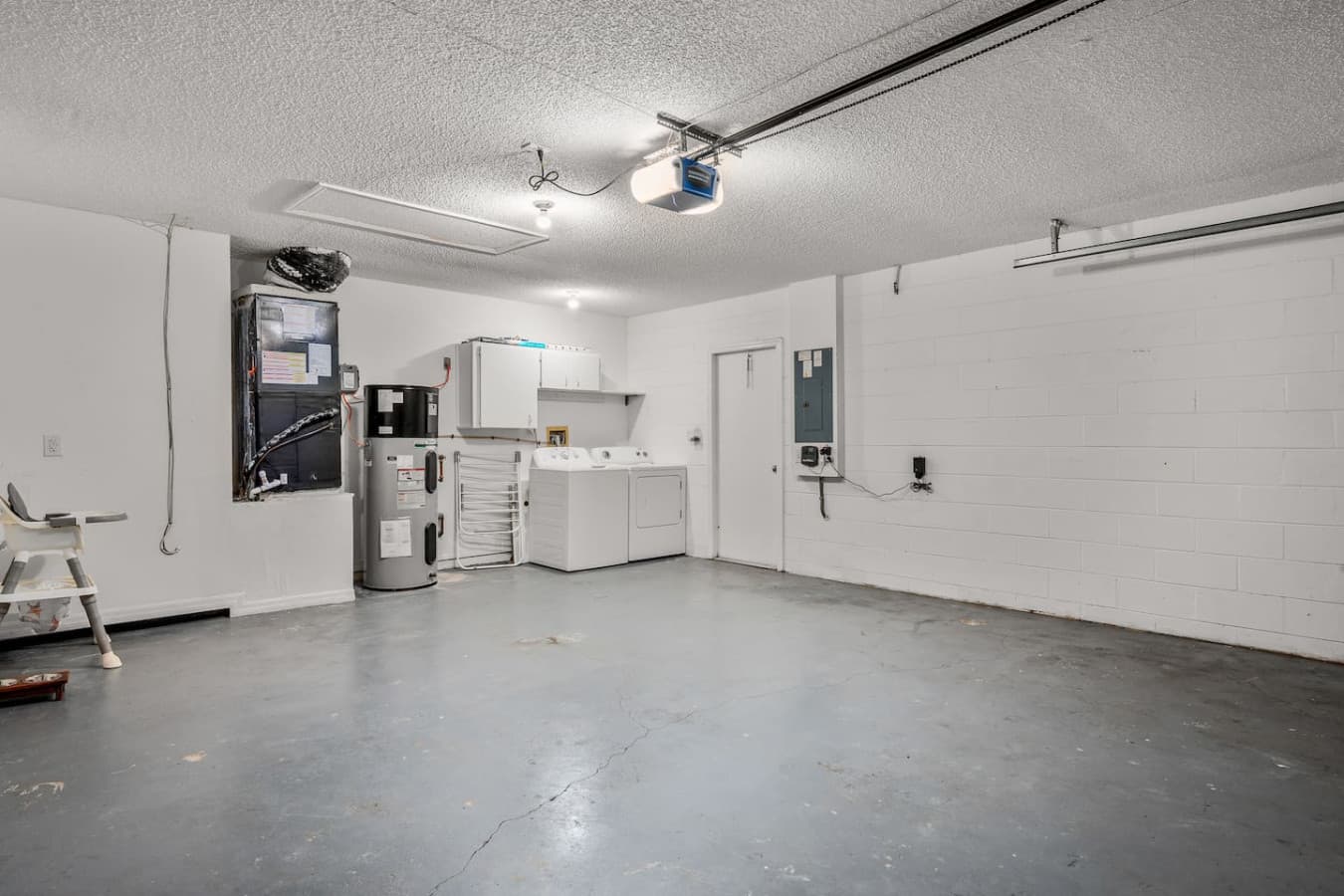 Spacious two-car garage with a convenient in-home laundry area.