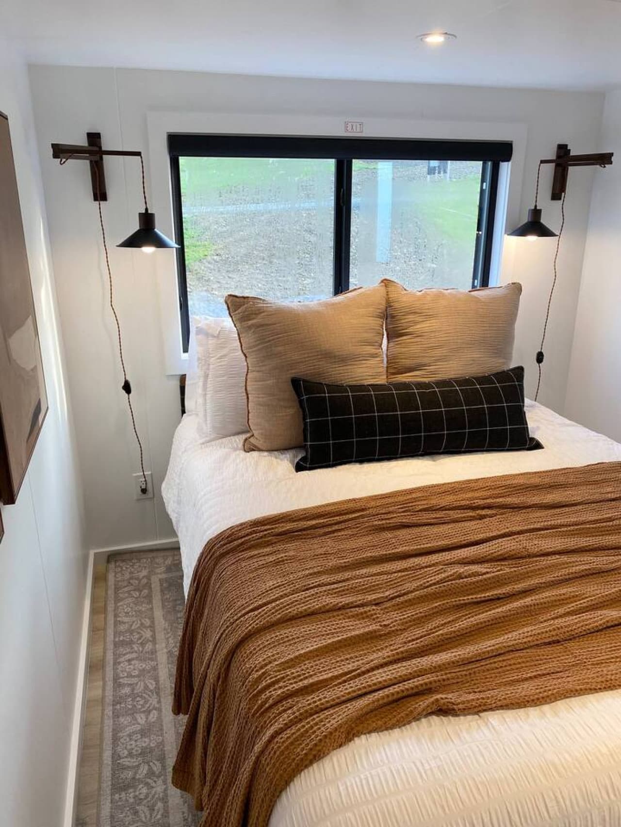 Wake up to peace and natural light in this serene bedroom.