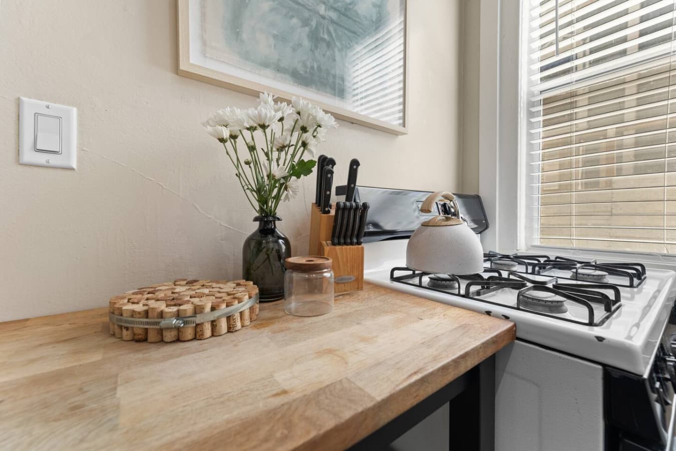Cook up something amazing! Our fully equipped stove makes it easy to whip up your favorite meals in this cozy kitchen.