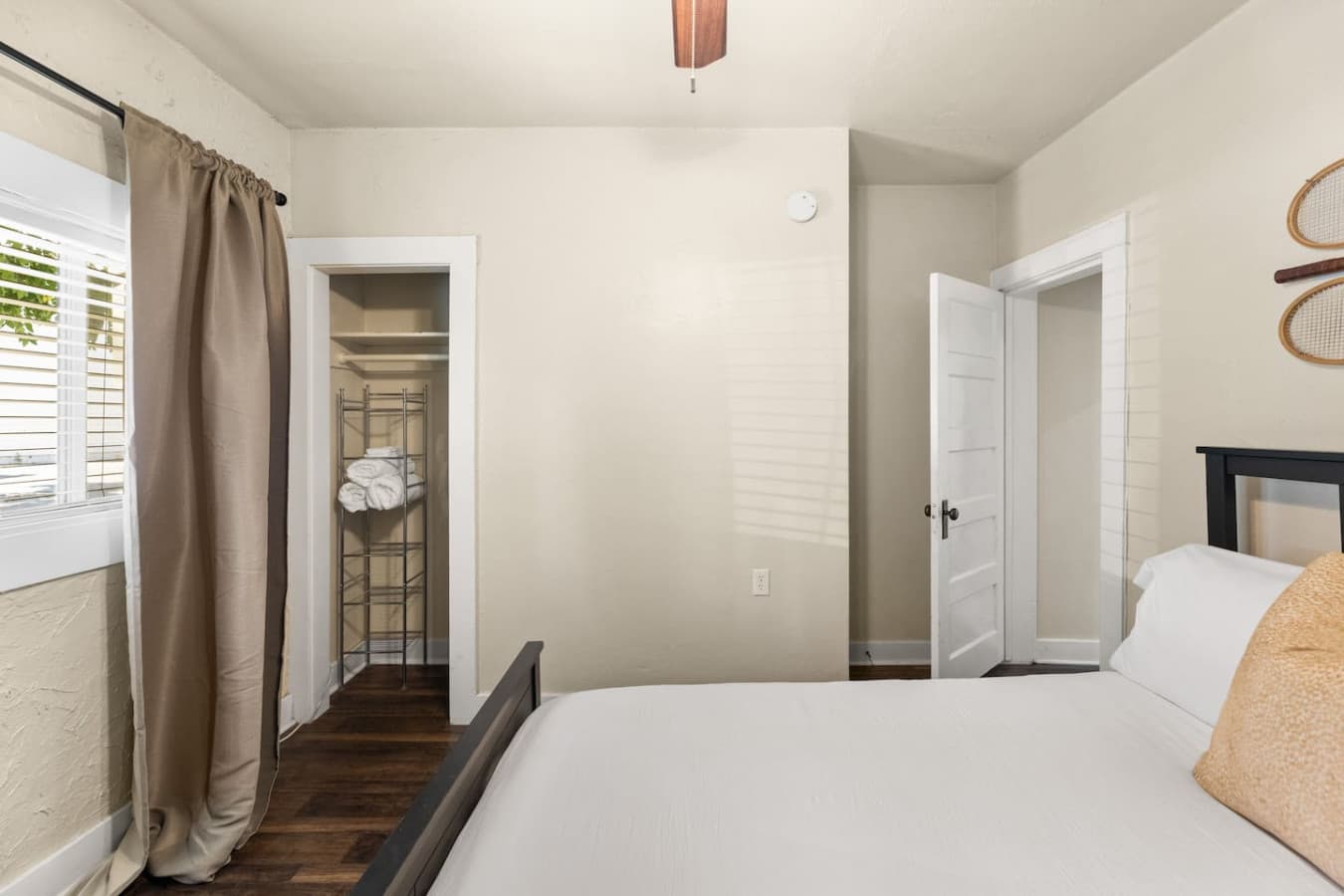 Sporty bedroom theme with a queen bed, ample storage, and windows for plenty of natural light.